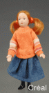 Docka, flicka med orange tröja